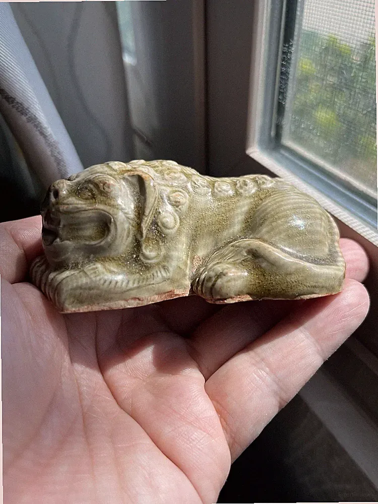 An old Chinese Yaozhou kiln small reclining lion